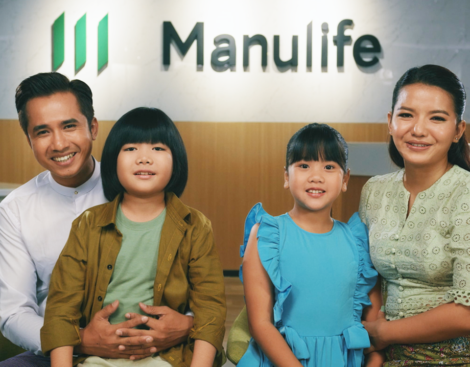 Image of a family in front of Manulife Myanmar Office Reception